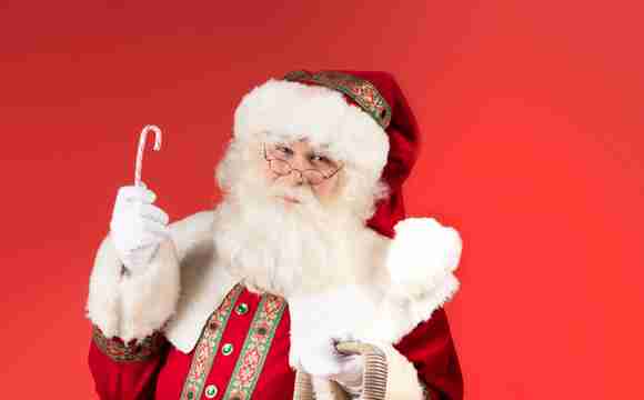 Kerstman deelt uit boeken 